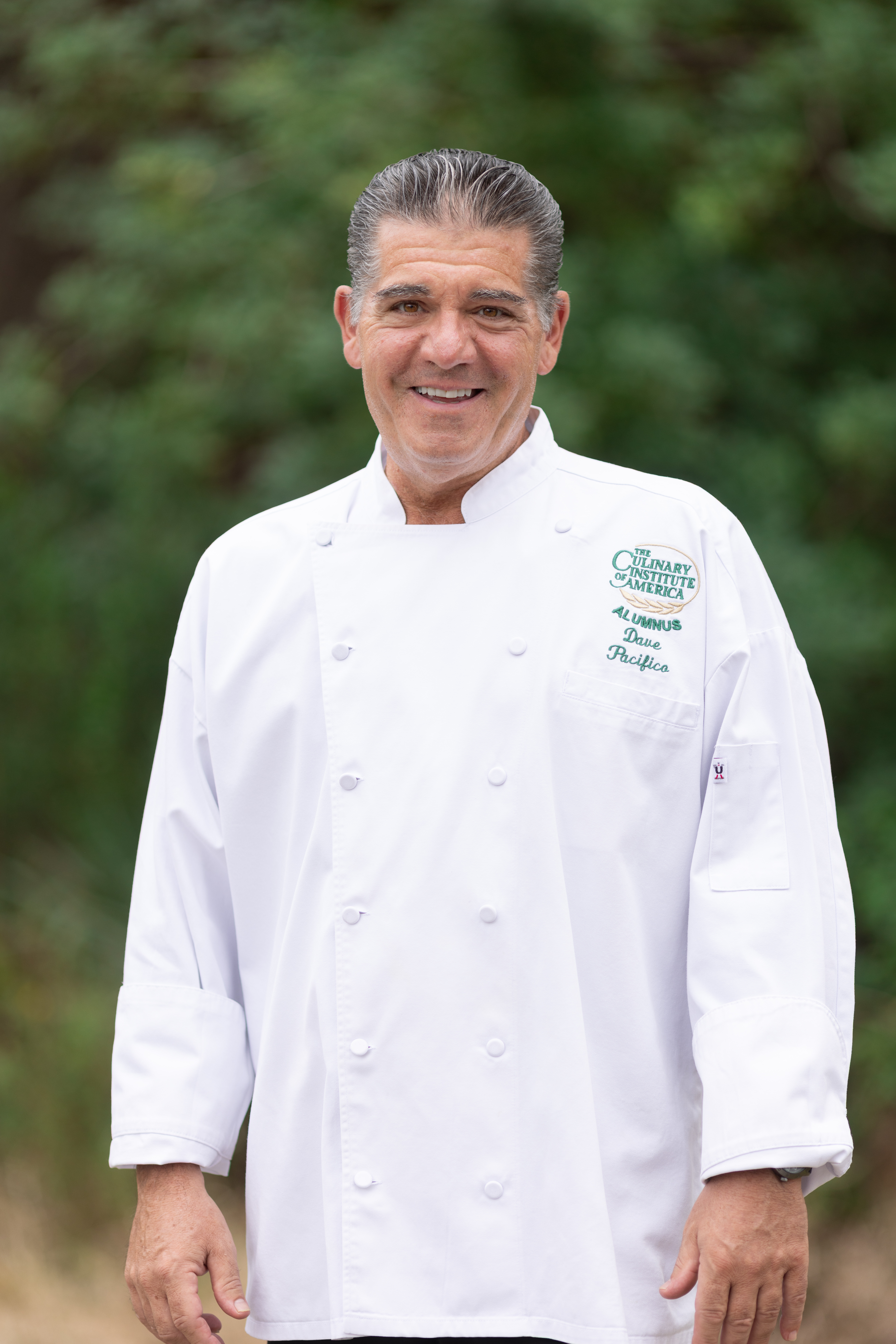 Chef Dave Pacifico plating a seasonal tasting course in a private residence kitchen